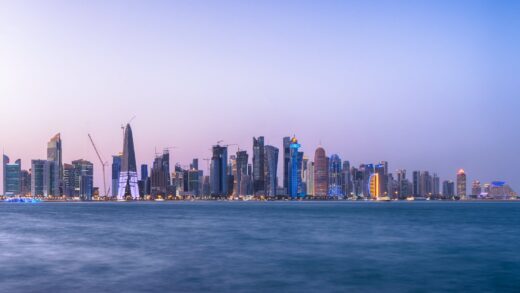 city skyline near body of water in doha qatar